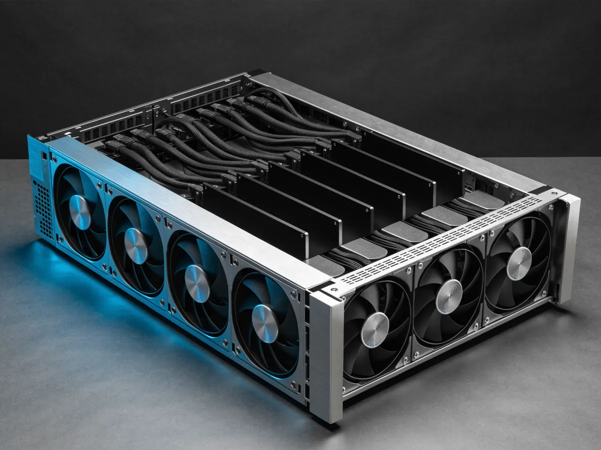 Open 4U server chassis with the lid off, showing a fan wall and eight full length double width accelerator cards standing in parallel in a riser cage, on a dark background
