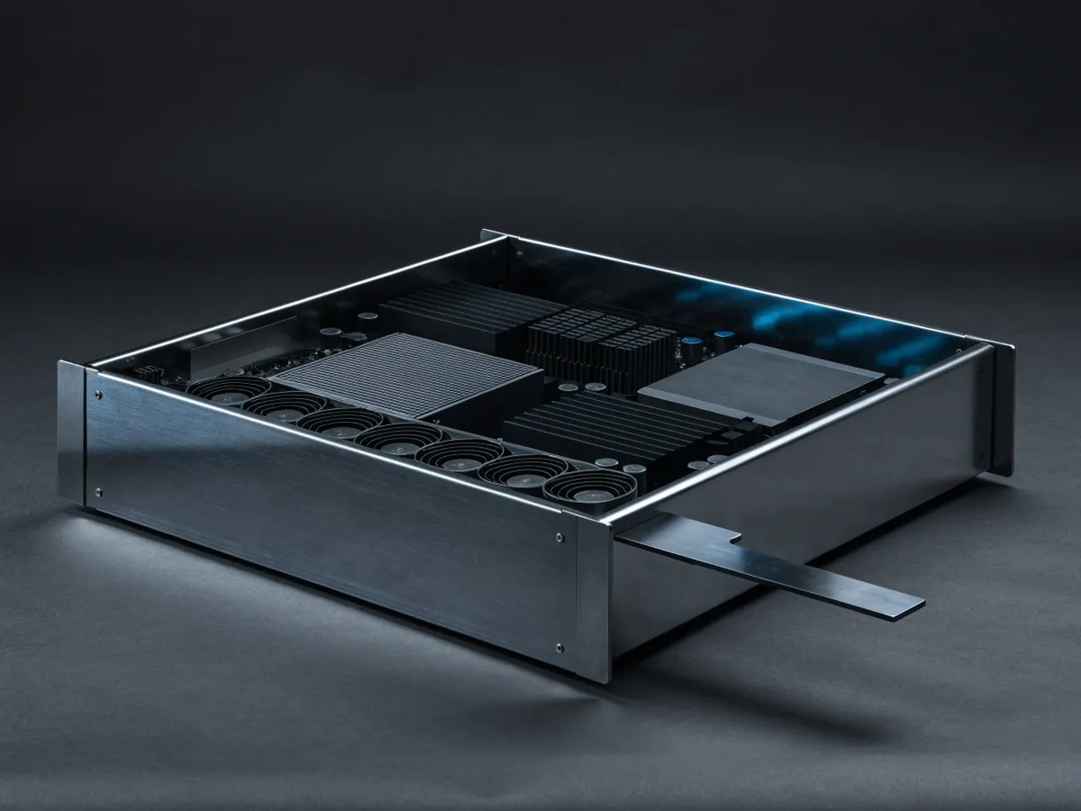 Open frame server node tray with no lid or bezel, showing an exposed motherboard, heatsinks, memory banks, a front fan row and a rear blade power connector, on a dark background