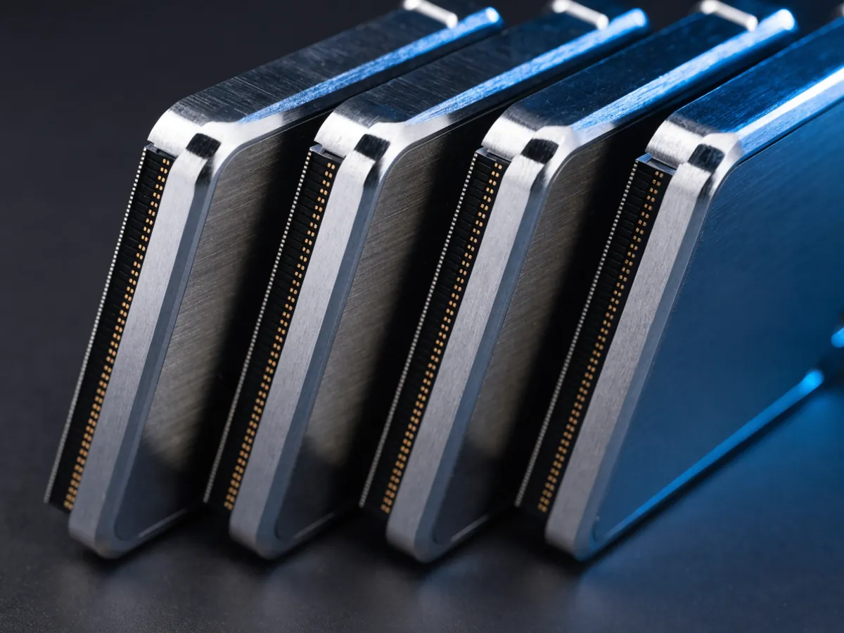 Close view of five thick 2.5 inch drives standing on edge, each showing a single continuous connector block along its bottom contact edge