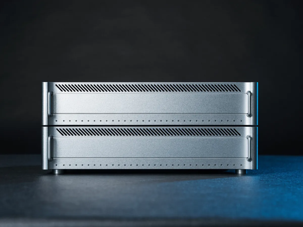 Two identical rackmount storage controller units stacked one above the other, front view, with blank faceplates and ventilation slots