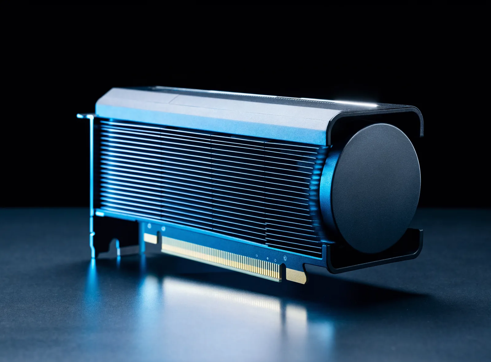 Data center GPU accelerator card with black blower cooler and gold PCIe connector on a dark surface